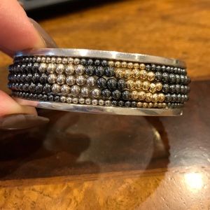 Vintage and stamped sterling silver bracelet. Five rows of beads inlayed.